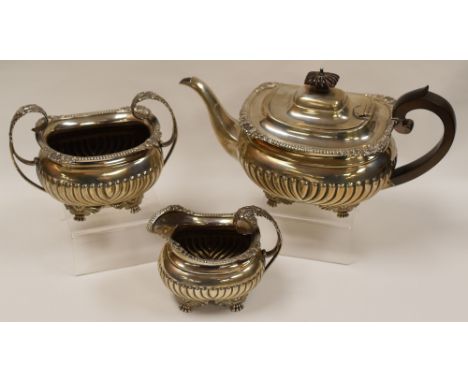 THREE PIECE SILVER TEA-SET each of fluted-form on four decorative claw-feet and comprising teapot with composition handle and