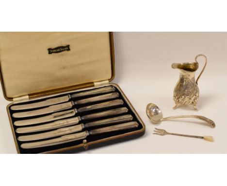 A PARCEL OF SILVER COMPRISING CREAM JUG, SUGAR LADLE, CASED SET OF TEA-KNIVES & TOASTING FORK