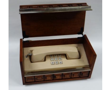 AN AMERICAN 'DESIGNER' TELEPHONE BY WESTERN ELECTRIC the plastic handset and phone with button dial concealed within in a hin