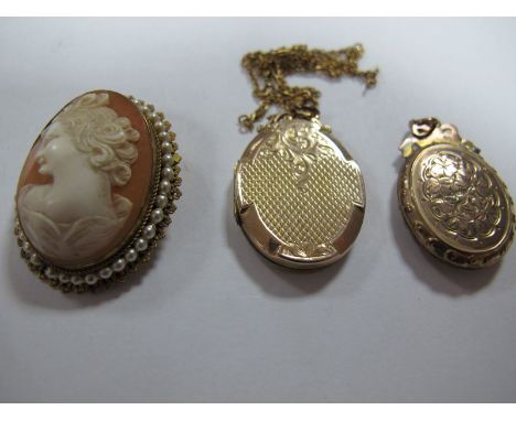 An Oval Locket Pendant, with engine turned decoration; together with another example, and an oval shell carved cameo brooch, 