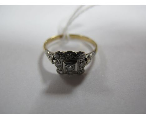 A Diamond Set Square Cluster Ring, between inset shoulders, stamped "18ct". 