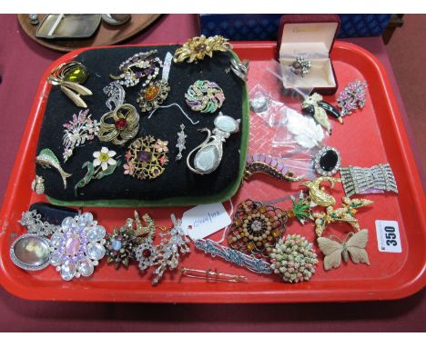 A Collection of Assorted Costume Brooches, including enamel dog brooch, butterflies, display pad, etc. 