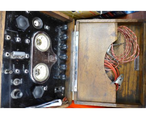 A cased fault finder marked The Pink Mouse, with instruction leaflet