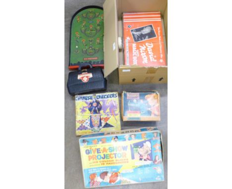 Pin Football bagatelle, a Chad Valley Give-a-Show projector, a Vulcan Junior, a David Nixon magic box, a Merit Family Doctor 