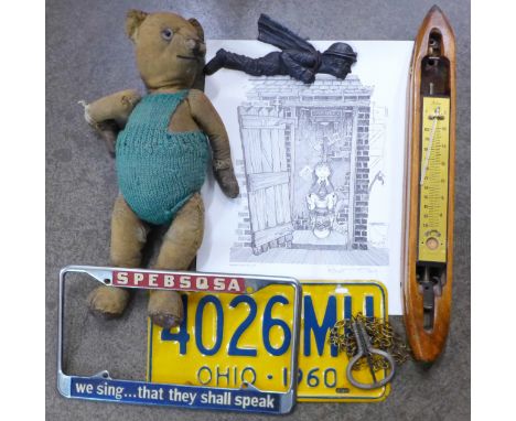 A Teddy Bear with jointed limbs, a U.S.A. number plate, resin figure, lace bobbin and three prints by Robert Olley