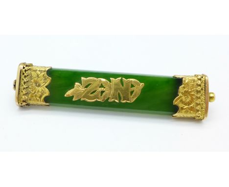 A yellow metal and jade New Zealand bar brooch