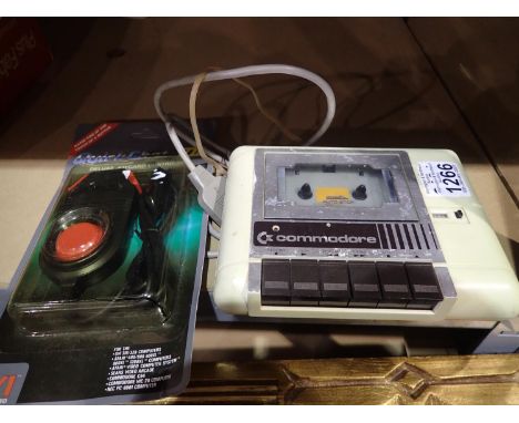 Commodore cassette player and a Quick Shot VII joycard controller. P&amp;P Group 2 (£18+VAT for the first lot and £3+VAT for 