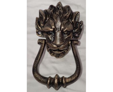 Cast iron bronzed lion mask door knocker, H: 20 cm. P&amp;P Group 1 (£14+VAT for the first lot and £1+VAT for subsequent lots