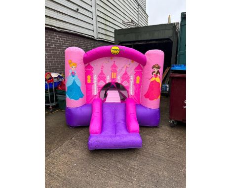 Princess slide and bouncy castle with box and pump, working at lotting. All electrical items in this lot have been PAT tested