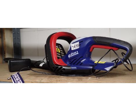 Spear &amp; Jackson cordless hedge trimmer, working at lotting. All electrical items in this lot have been PAT tested for saf