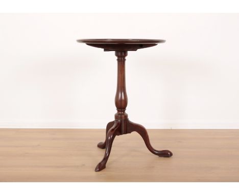 A GEORGE III MAHOGANY TRIPOD TABLE the dished tilt top on a baluster turned stem with cabriole legs and pad feet, 68cm high x