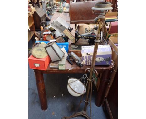 A VINTAGE SEWING MACHINE a brass standard lamp, clocks, old fittings and sundries (all from a loft clearance)
