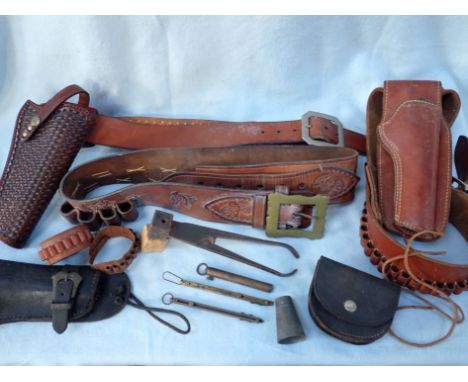 A COLLECTION OF AMMUNITION BELTS, HOLSTERS, A BULLET MOULD and other items