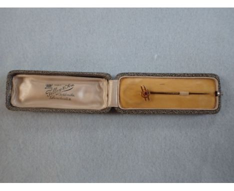 A GENTLEMANS GOLD AND RUBY STOCK PIN