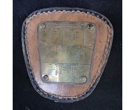 A COMPASS IN A LEATHER CASE