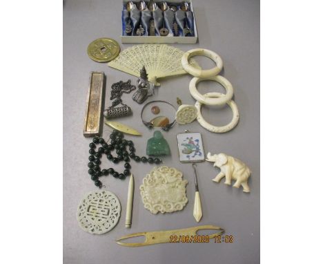 A Jade necklace, bone items, a pre 1947 ivory elephant A/F, mixed oriental items and teaspoons 