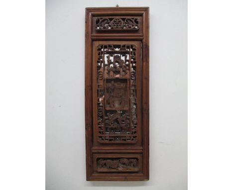 A 19th century Chinese pine panel with a moulded frame, carved and pierced panels of animals, figures and foliage with a late