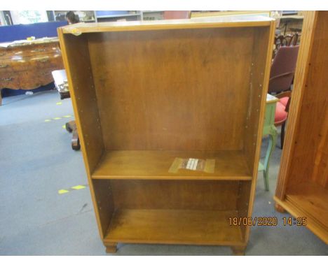 A walnut bookcase with one shelf, together with a beech single bed frame, a mid 20th century walnut finished cabinet and a Vi