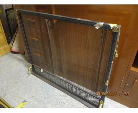 An early 20th century firescreen with metallic fire curtain 