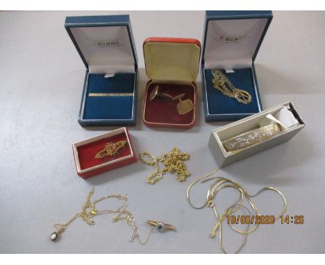 A quantity of gold jewellery to include 9ct gold cufflinks and tie pin, a gold chain with opal and sapphire pendant and a yel