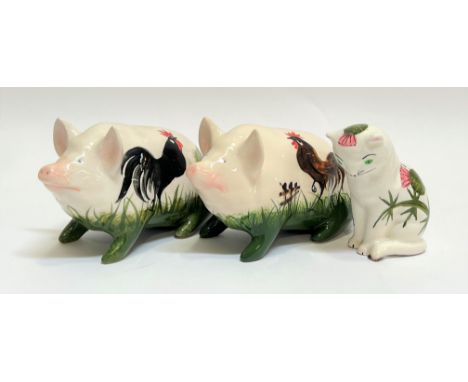 Two Wemyssware Griselda Hill pottery pigs painted with chickens/cocks and grass (marked verso 'G.Hill Pottery' with painter's