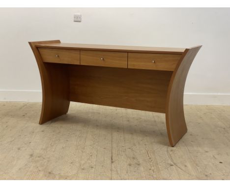 Tom Schneider Embrace range, a contemporary cherry wood dressing table or console table, fitted with three drawers, raised on