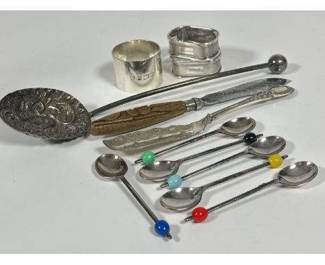 A collection of Epns including a set of six coloured bean handled coffee spoons, two butter forks and an Edwardian chased bal