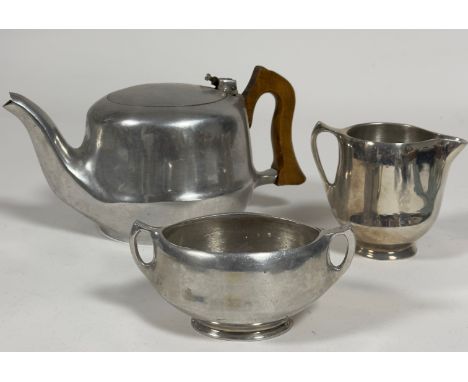 A Vintage  Picquot ware aluminium three piece tea set, the tea pot with treen handle to side, (h x 12cm x d 12cm)