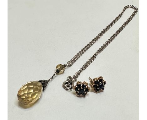 A tear drop shaped citrine and bead mounted pendant on white metal chain, teardrop (l 2.5cm) and a pair of 9ct  gold sapphire