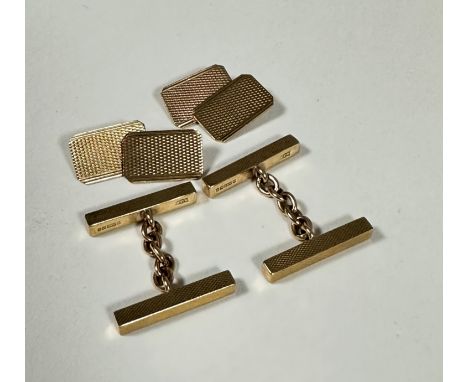 A pair of 9ct gold rectangular engine turned sleeve links, unascribed, (l x 1.6cm x 0.8cm) and a pair of 9ct gold twin rectan