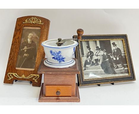 An early twentieth century coffe grinder with incorporated blue and white china bowl (h- 20cm), together with two photograph 