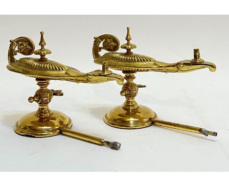 A pair of late nineteenth/early twentieth century lacquered brass Adam style table mounted gas cigar lighters in the form of 