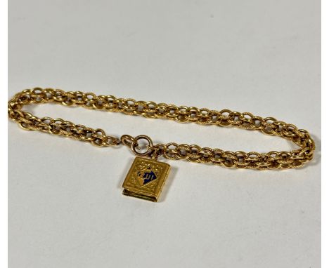 An 18ct gold triple open barrel link chain bracelet, (l  21cm) with with yellow metal Quran charm. 7g
