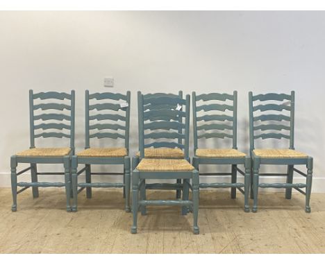 A set of six blue painted ladder back dining chairs with rush seats raised on turned supports H100cm