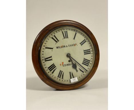 A circular mahogany cased wall clock time piece, early 20th century, the white painted dial 12" with Roman chapter ring inscr