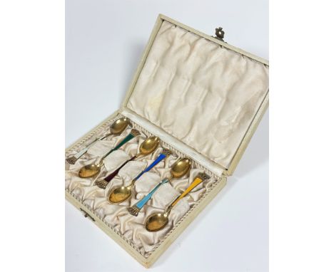 A set of six Ela Danish sterling silver gilt enamelled coffee spoons with coronet style terminals in original fitted box, (l 