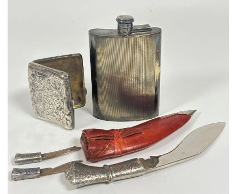 An Epns curved hip flask with engine turned decoration and screw down top, ( h x 14cm x l 9cm), a Birmingham silver engraved 