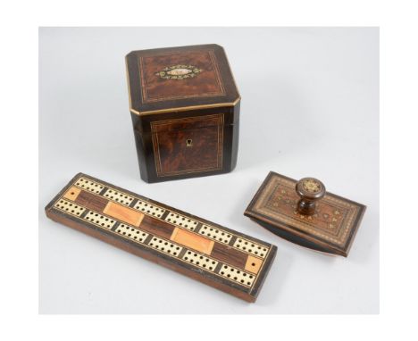 A cribbage board inlaid with rosewood, satinwood and bone with pegs in sliding compartment to base, rocking desk blotter with