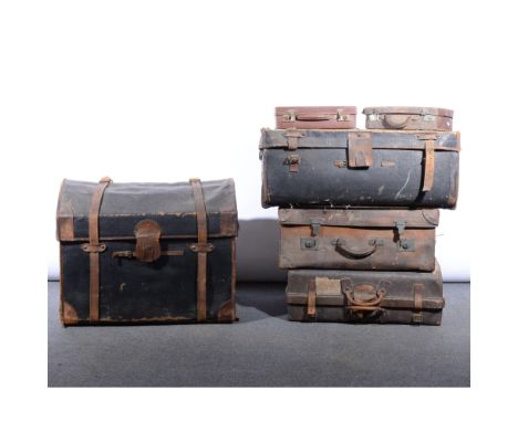 Edwardian cloth and leather domed top trunk, by Richard Clamp, Liverpool, 77cm; two old leather suitcases; another cloth trun
