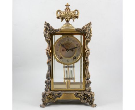 French style American four glass mantel clock, cast urn finial, silvered dial with visible escapement, movement striking on a