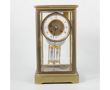 French Brass four glass mantel clock, Japy Freres movement striking on a gong, with a mercury pendulum, circa 1900, white ena