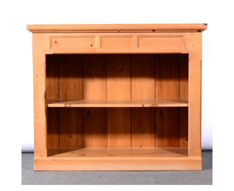 Contemporary pine open bookcase, panelled frieze, fitted with a single shelf, plinth base, width 122cm, height 101cm.