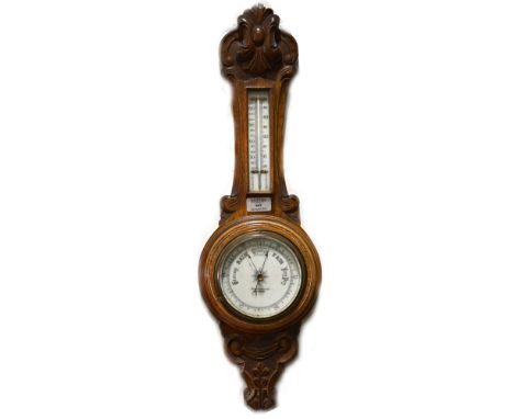 Carved oak aneroid barometer, the dial signed Benetfink &amp; Co. Ltd, Cheapside, thermometer over, 70cm.