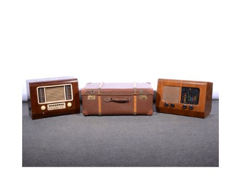 Pye model P35 walnut cased mains radio, width 51cm; an HMV model 1119 mains radio; and an Orient make cloth trunk, (3).