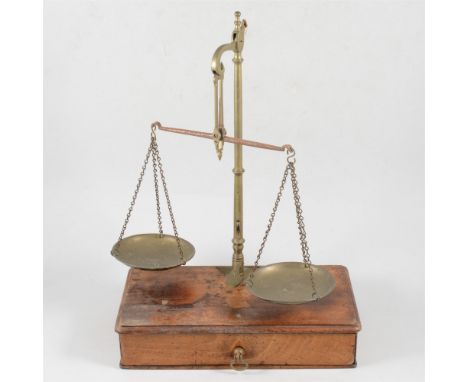 Set of brass and steel beam balance scales, W &amp; T Avery, mahogany platform with a drawer, 26cm and a collection of small 