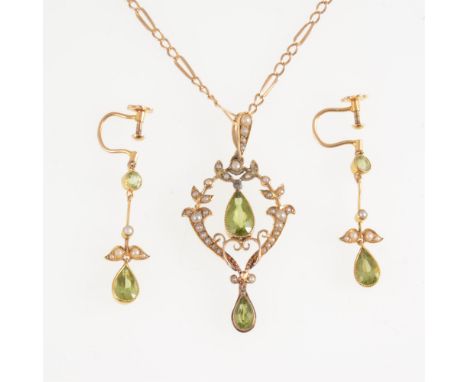 An Edwardian peridot and seed pearl pendant 40mm, set with pear shaped stones, marked 15ct on back, and having a pearl set ba