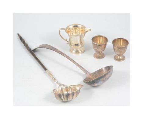 A silver punch ladle by John Pollock, whale bone barley twist handle, London 1741; a silver milk jug, 7.5cm, Birmingham 1923;