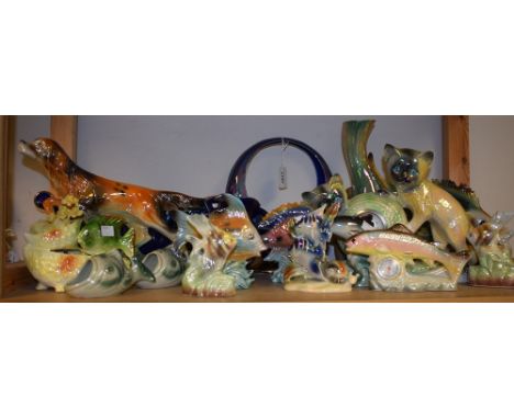A 1950s/60s novelty kitsch lustre glazed model of a gun dog; similar mantel clock mounted with a pair of kittens; fish models