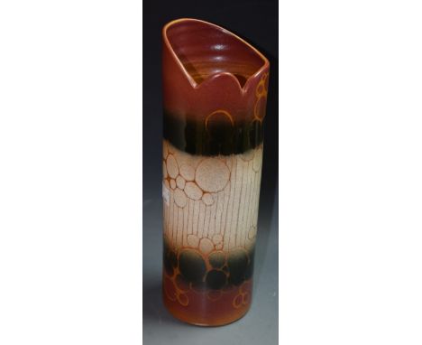 A Poole cylindrical vase, decorated in stones, black and mauve with bubbles and incised lines, 28cm high, printed mark