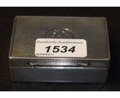 A silver snuff box, engine turned, London 1871, George Aldwinkle, 107g
